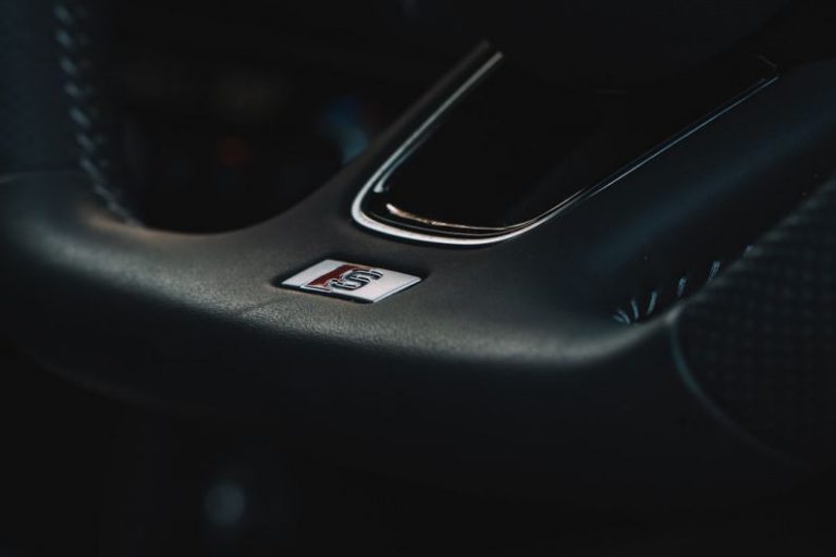 Steering Wheel Australia - black honda steering wheel in close up photography