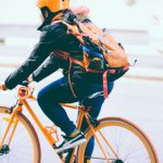 Helmet Safety Australia - closeup photo of person riding a orange bicycle