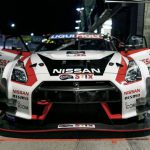 Motorsports Race Australia - white, red, and black Nissan vehicle
