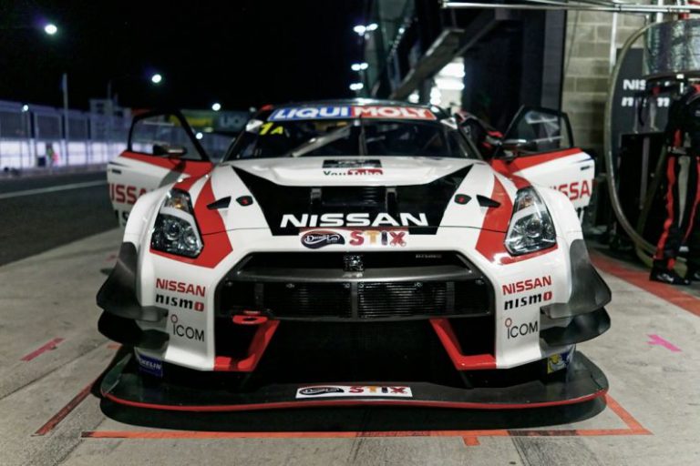Motorsports Race Australia - white, red, and black Nissan vehicle