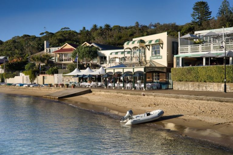 Boutique Hotel Australia - an inflatable boat on the shore of a beach