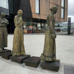 Urban Hotel Australia - a group of statues in front of a building