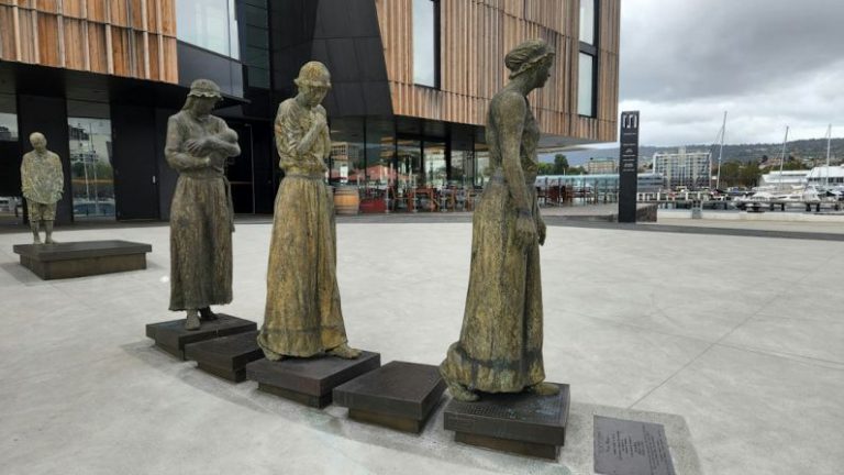 Urban Hotel Australia - a group of statues in front of a building
