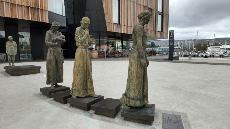 Urban Hotel Australia - a group of statues in front of a building