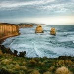 Winery Visit Australia - HDR photo of two rock formation on sea under cloudy sky during daytime