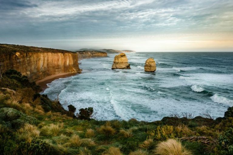 Winery Visit Australia - HDR photo of two rock formation on sea under cloudy sky during daytime