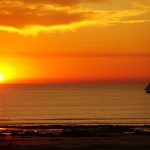 Cable Beach Australia - a sailboat in the ocean at sunset