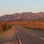 Australia Road - gray concrete road near brown mountains during daytime