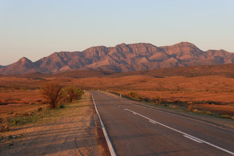 Australia Road - gray concrete road near brown mountains during daytime