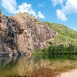 Kakadu - green and brown mountain beside river under blue sky during daytime
